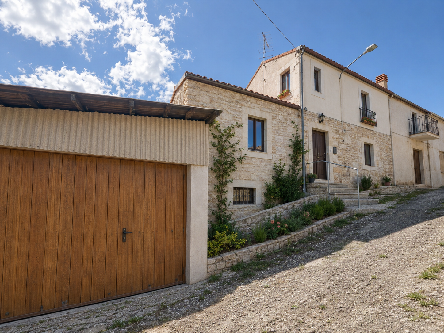 Visual hypothesis for the same roadside house, retaining the garage, lane, streetlight and stepped entrance while presenting the walls, windows and planting as repaired.