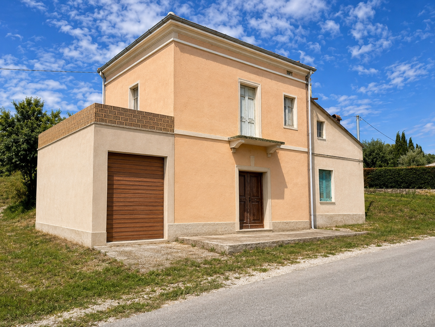 Visual hypothesis for the same rendered villa, retaining the garage extension, facade proportions, road and upper openings while presenting repaired peach render and restored doors and shutters.